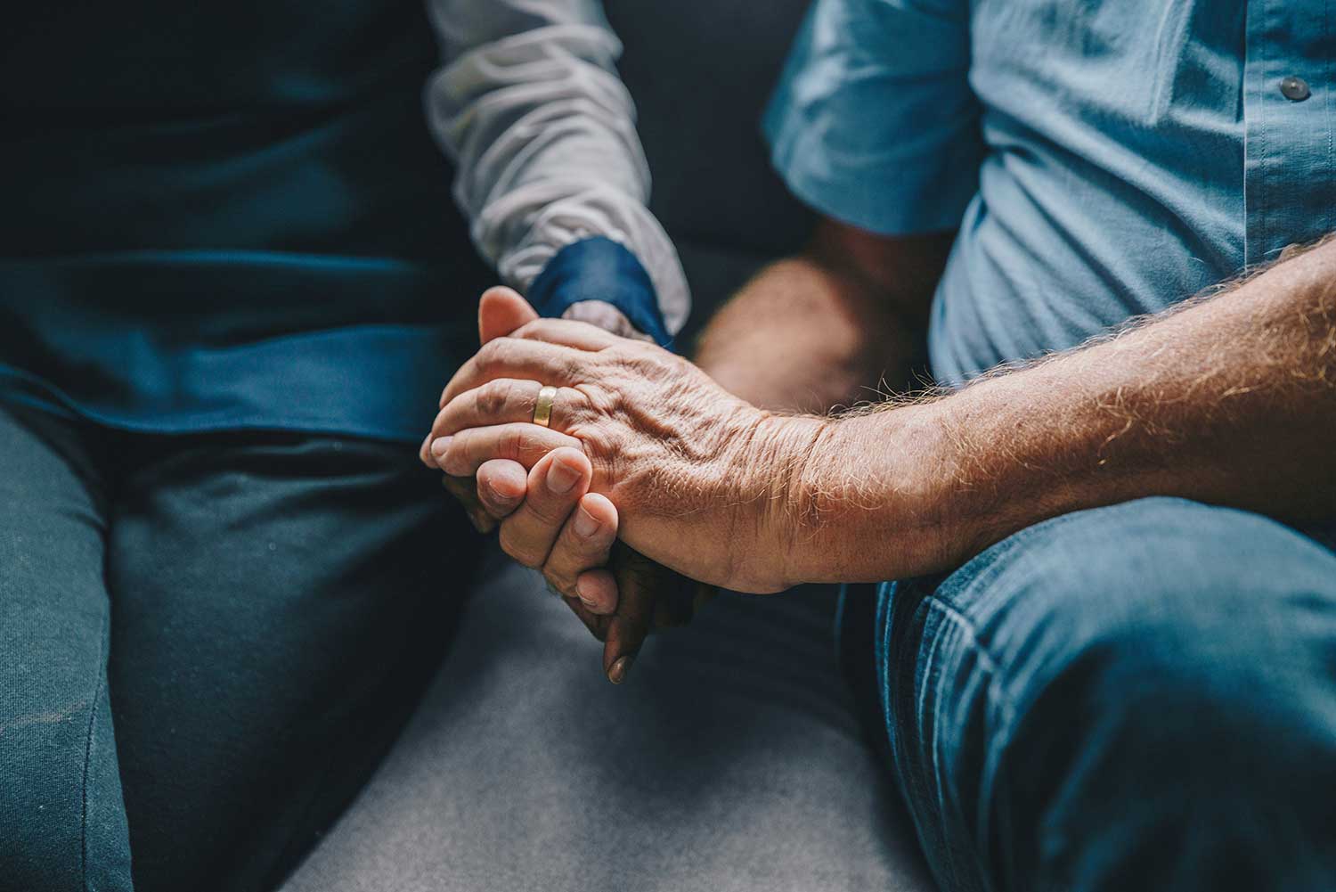 senior couple holding hands