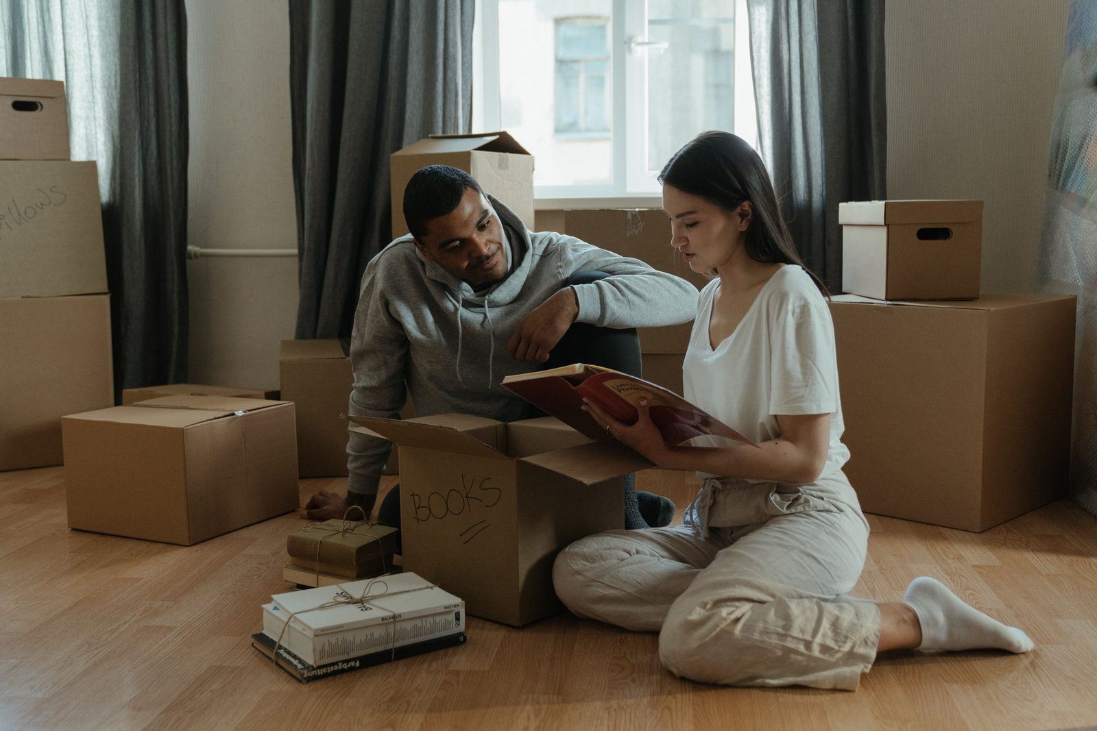 Couple unpacking books together in their new Ottawa home